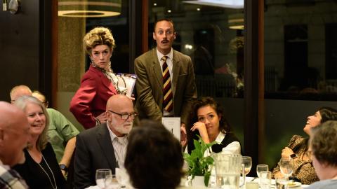 Cast of the Faulty Towers Dining Experience in a restaurant.