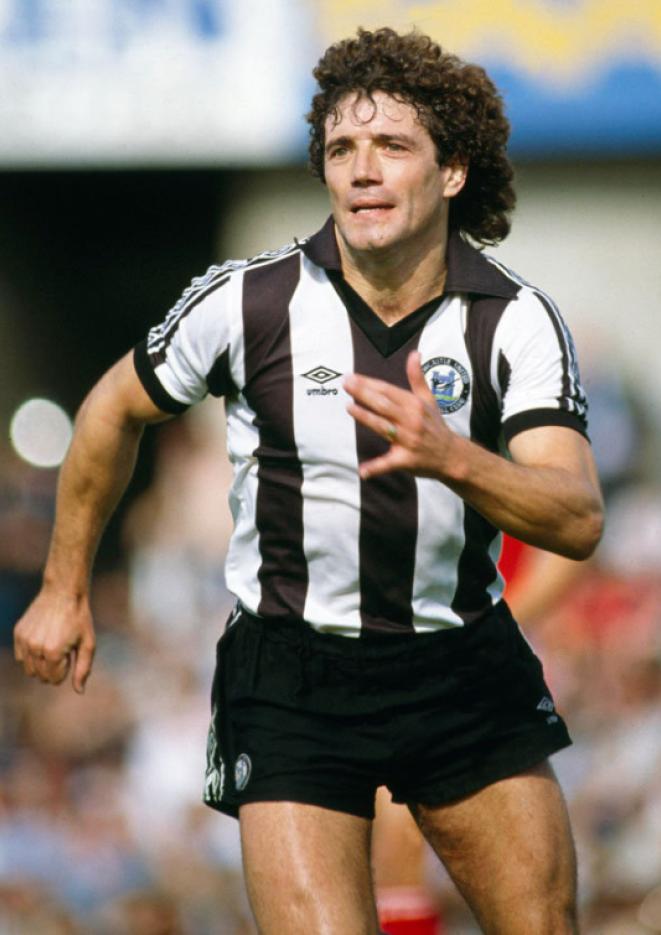 An old photograph shows footballer Kevin Keegan playing while wearing a Newcastle United stiped black and white kit.